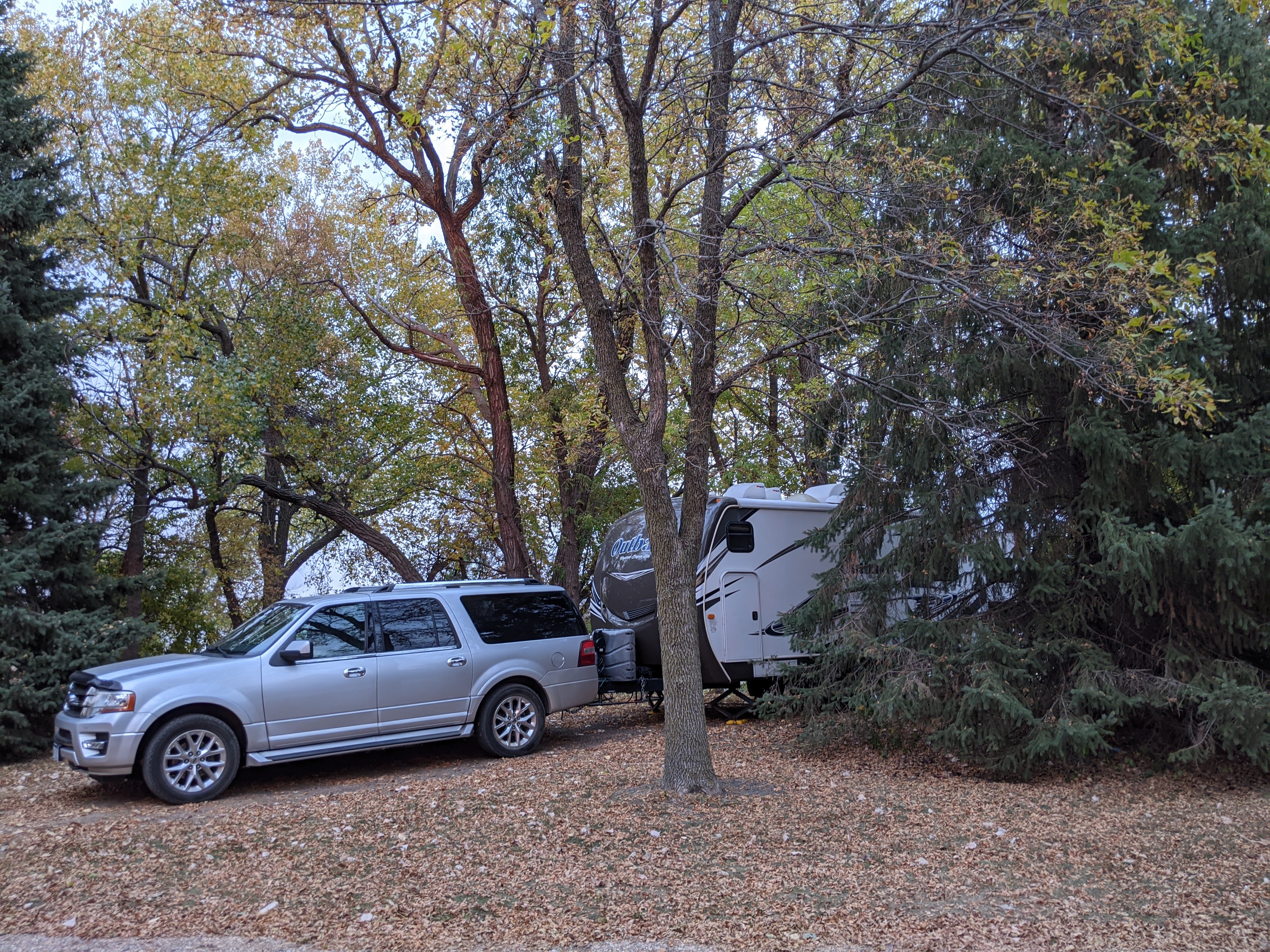 rig nestled in trees in park site