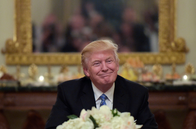 Trump fake grinning