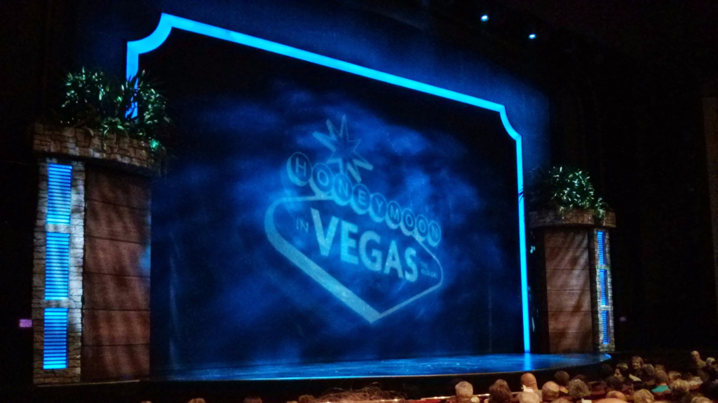 Honeymoon In Vegas curtain with projected logo